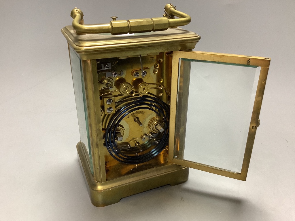 An early 20th century laquered brass repeating carriage clock with alarm, marked apprentice of Breguet, height 12cm